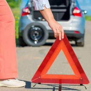 Driver documenting a minor car accident with photos
